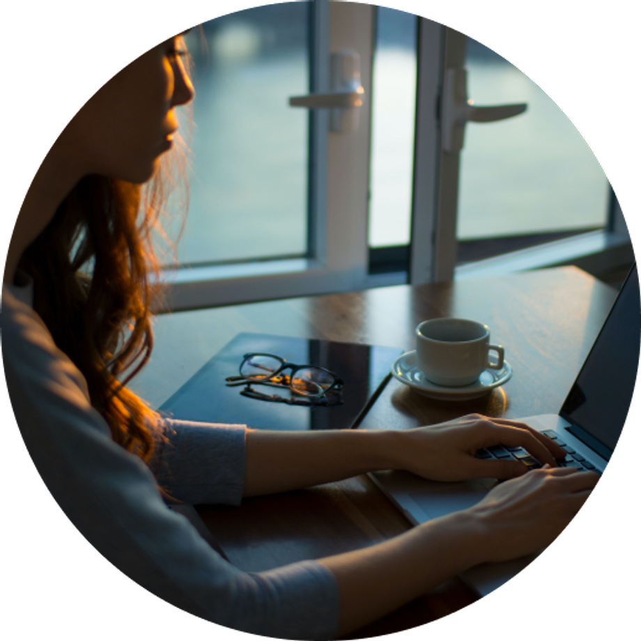 Woman working on a computer in the afternoon