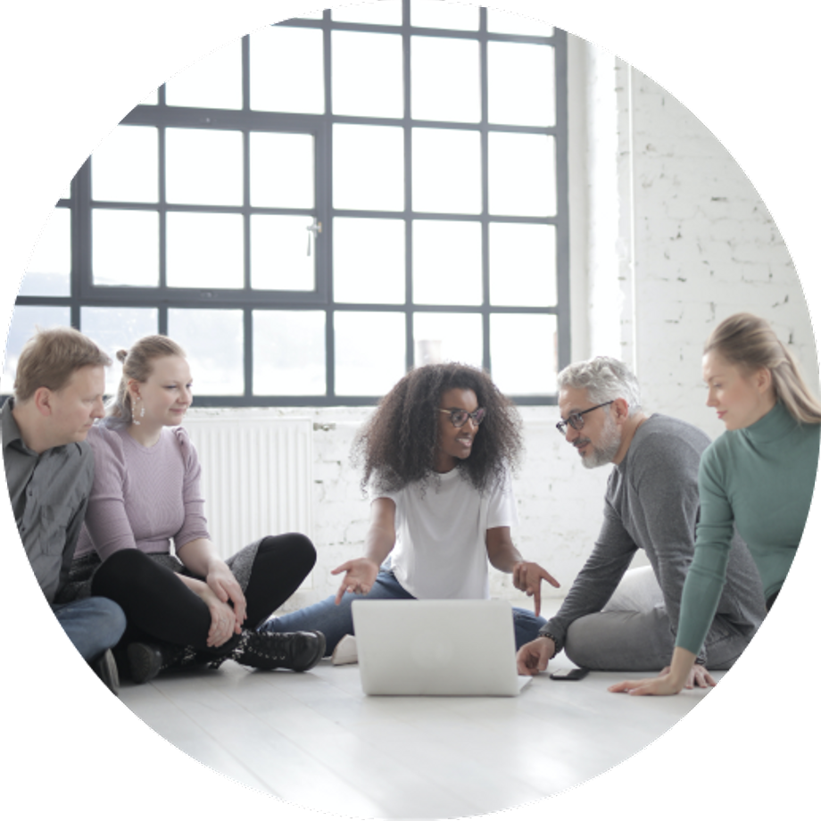 Black woman showing four other people something on her laptop