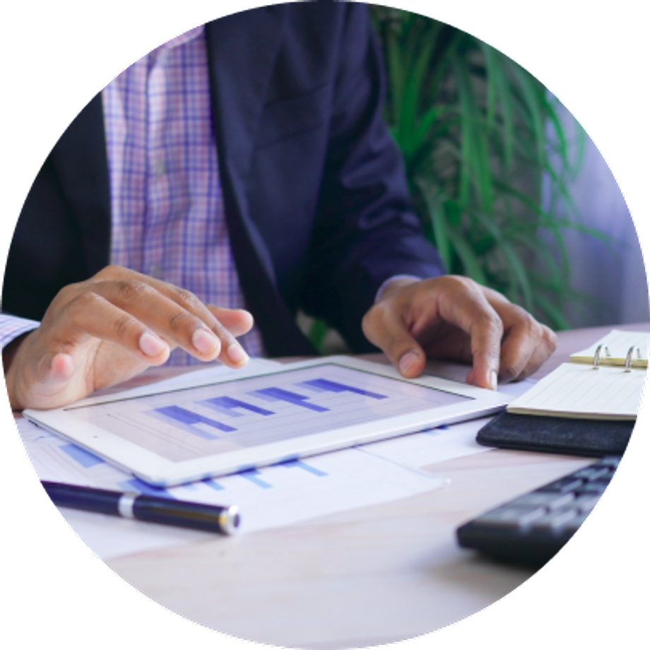 Black man's hands showing some charts on a tablet