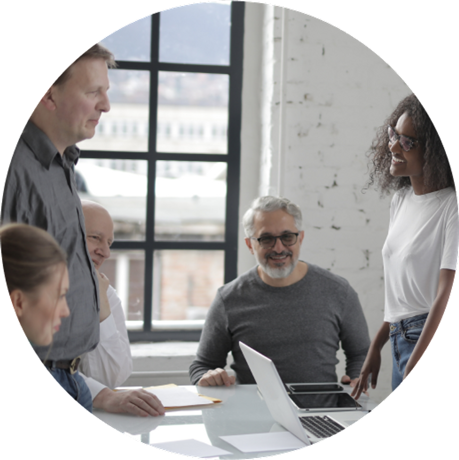 People having a meeting, smiling and talking to each other