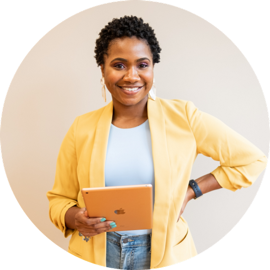 Smiling black business woman holding an iPad