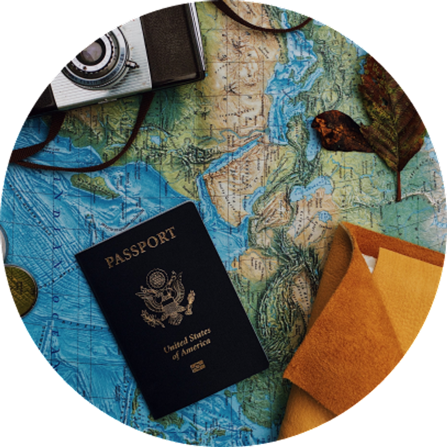 Map with a passport document, some leaves and a camera