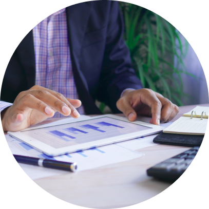 Black man's hands showing some charts on a tablet